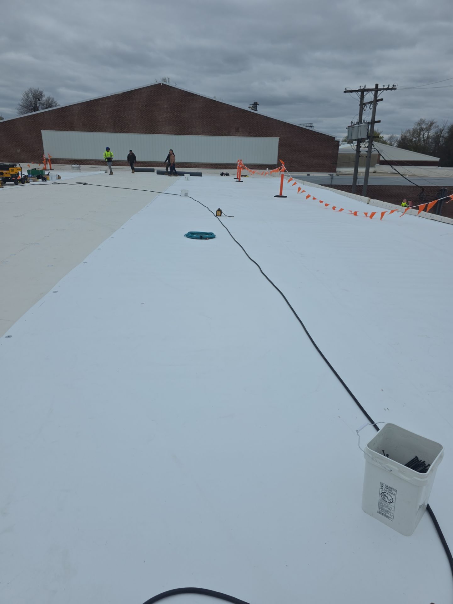 White GAF EverGuard TPO membrane being installed at Appleton Public Library
