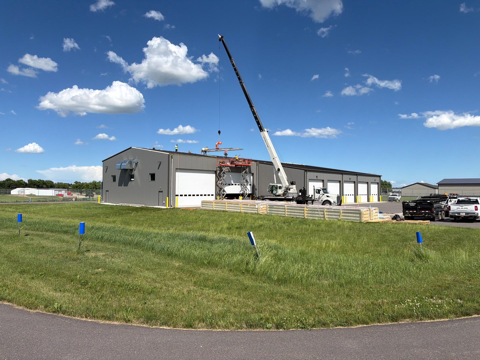 The Roofers crew installing insulated standing seam roofing at the Watertown Airport SRE Building